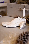 Old shoe last used as candlestick and Christmas decoration