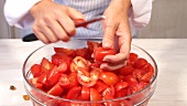 A tomato being quartered
