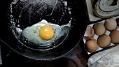 Butter being heated in a pan to make a fried egg