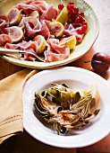 Roasted Artichokes in a Bowl; Prosciutto and Figs in a Bowl