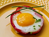A stuffed tomato filled with a fried egg
