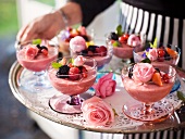 Summery raspberry mousse with roses and a berry garnish