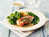 Stuffed chicken breast with herb sauce and green beans