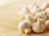 Fresh mushrooms on a bamboo mat