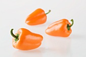 Three orange peppers