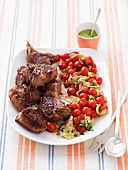 Lamb chops with fried tomatoes and artichokes