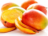 Bright mangos, one sliced