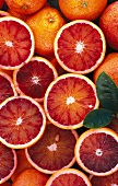 Blood oranges, whole and halved (seen from above)