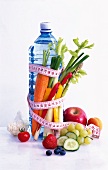 A bottle of water with a measuring tape, vegetables and fruit