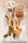 Green asparagus in spring roll pastry with a chilli, cucumber and peanut dip