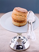 Scones with silver cutlery on a cake stand