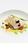 Steamed bass with peas, leek and wheat