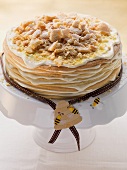 A layered honey cake on a cake stand