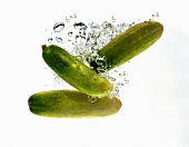 Cucumbers falling into water