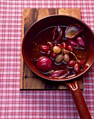 Braised onions with grapes