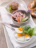 A supper of meatballs, sausage salad and egg salad