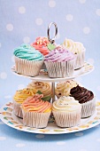 Cupcakes with colourful frosting on a cake stand
