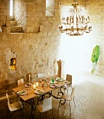 Set dining table in tower interior in Chateau Maignaut (Pyrenees, France)