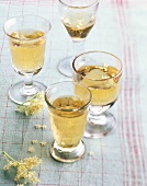 Four glass of elderflower champagne