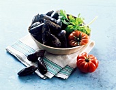 Fresh mussels, tomatoes and parsley in a bowl