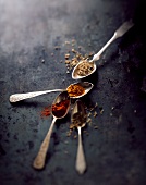 Oriental spices on four spoons