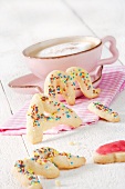 A cup of coffee with letter-shaped biscuits for Mother's Day