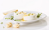 Goat's cream cheese with thyme on a plate