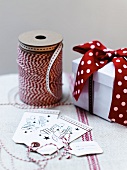 Festive gift tags, ribbon and gift box