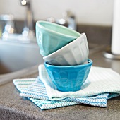 Small Prep Bowls Stacked on Kitchen Towels on a Kitchen Counter