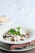 Risotto with mushrooms, pumpkin seeds, rocket and Parmesan
