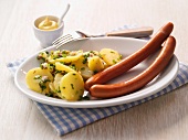 Hot dog sausages with parsley potatoes and mustard