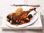 Goose leg with prunes and potato dumplings