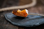 Quince jelly on a spoon