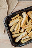 Roast parsnips in an old roasting tin