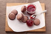 Chocolate macaroons with raspberry filling