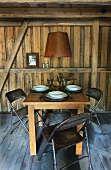 Set table in wooden cabin