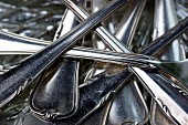 A pile of silver cutlery