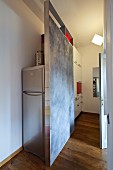 DIY partition screening fridge in modern kitchen