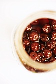 Overhead of an Open Jar of Cherries Preserved in Alcohol