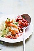 Smoked salmon on strips of vegetables with a strawberry sauce