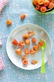 Golden Raspberries in a Plate Sprinkled with Sugar; Bowl of Fresh Golden Raspberries