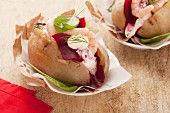Baked potatoes with beetroot and prawns