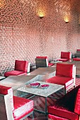 Devi Ratn Hotel - monolithic furnishings with red cushions in lobby