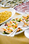Plates of starters including surimi salad