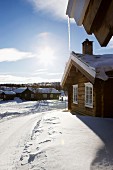 Cluster of wooden houses in snowy winter landscape