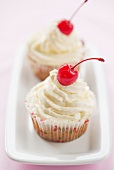 Cupcakes with glacé cherries