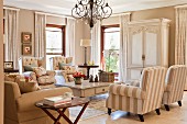 Sitting area in a traditional living room with a combination of bright, elegant country home furniture