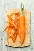 A peeled carrot on a chopping board