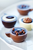 Filled chocolates in the shape of coffee cups