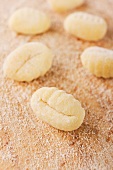 A number of fresh gnocchi with flour